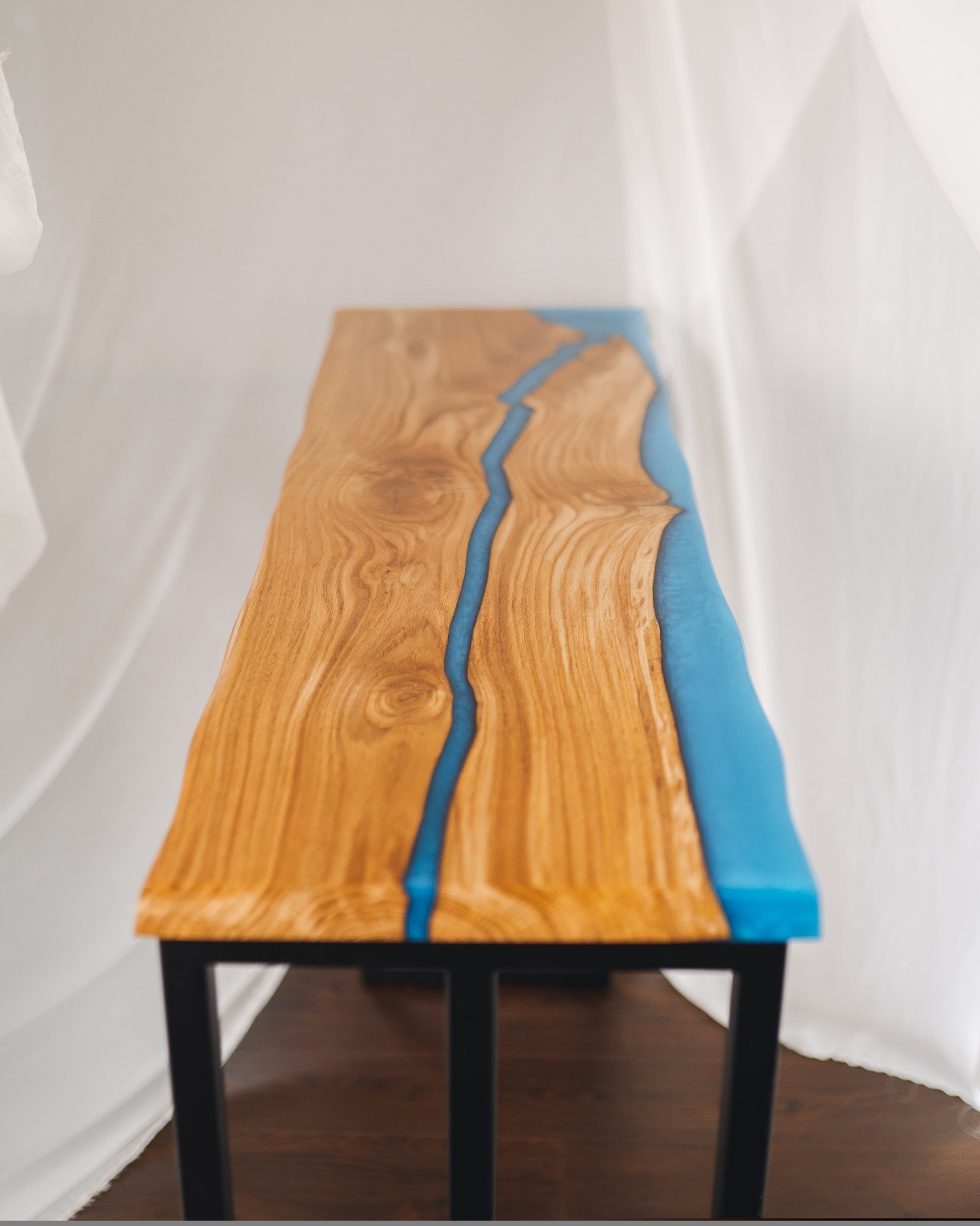 Bar table close-up — epoxy river and oak grain