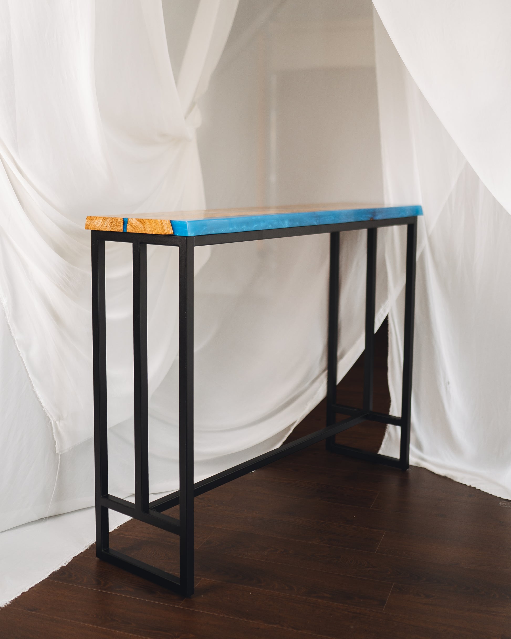 Bar-height oak epoxy bar table in a modern kitchen