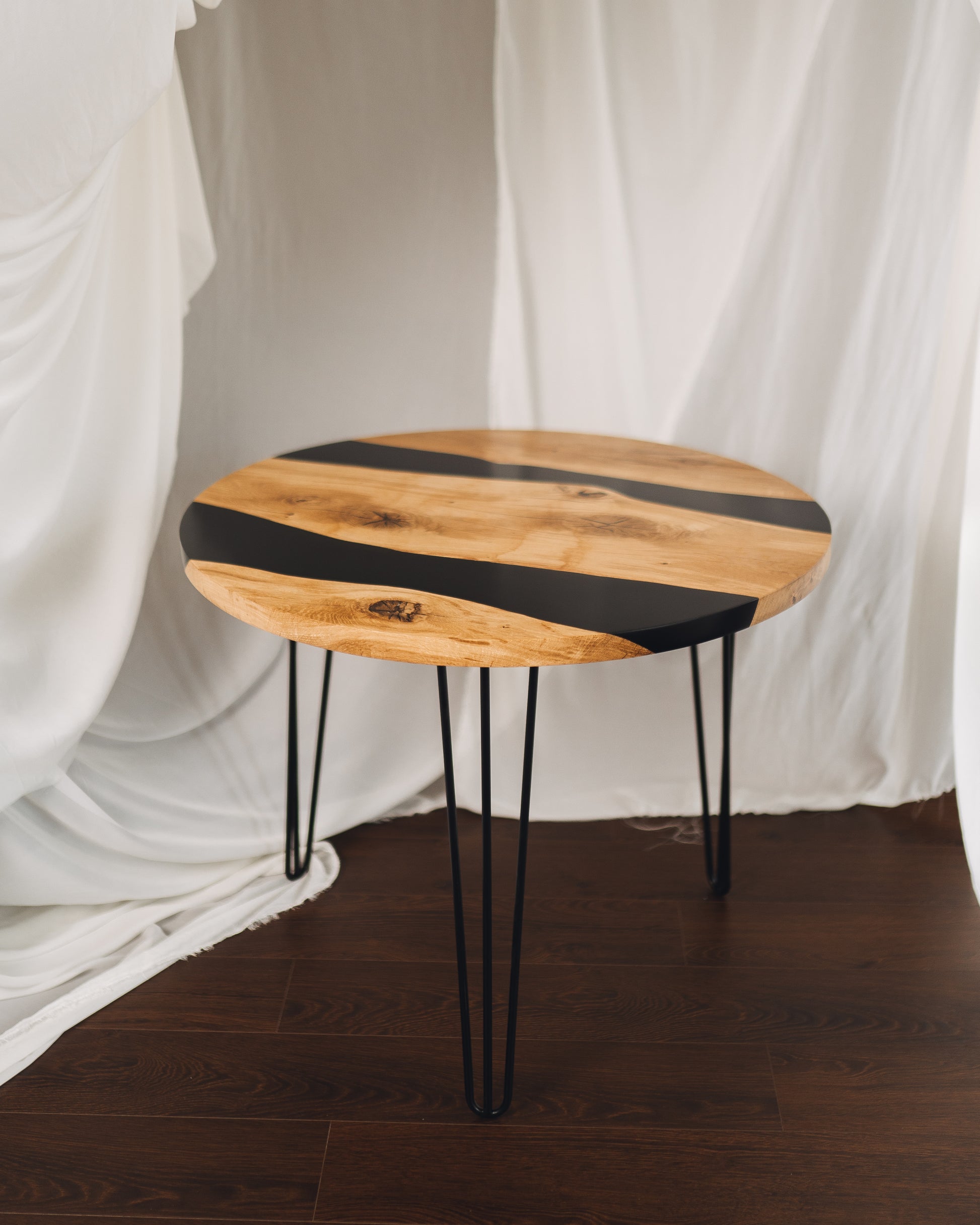 Round oak coffee table styled in modern living room